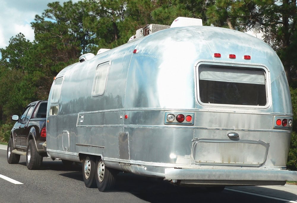 Airstream Style RV Pulled on Highway